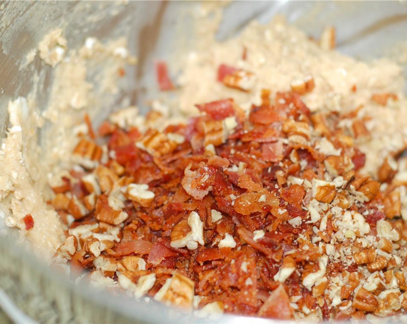 step 4 In a small bowl, beet the Egg (1) and mix with the Milk (1/2 cup) until blended. Add this to flour mixture along with the Bourbon (2 Tbsp). Add Quick Cooking Oats (1/2 cup), bacon, and Pecans. Mix on low until fully incorporated.