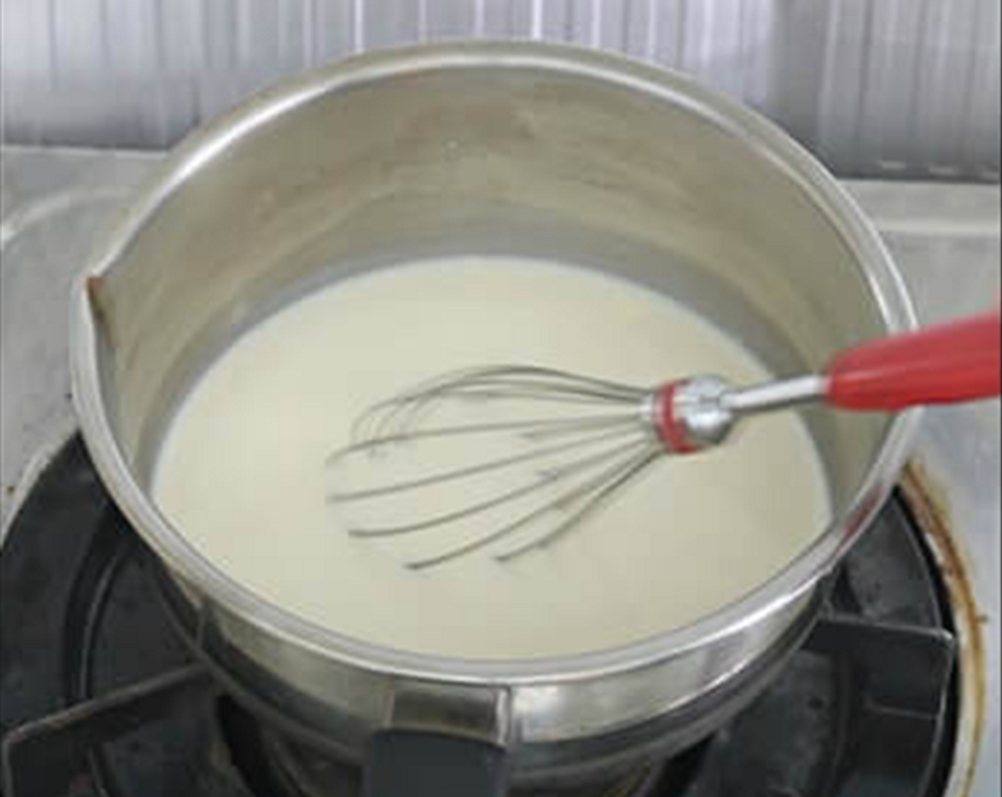 step 1 For the black sesame pudding - In a pot, add the Unsweetened Soy Milk (3/4 cup), Whipped Cream (3 1/3 Tbsp), and Caster Sugar (2 2/3 Tbsp) together. Lightly boil the liquid mixture and stir the sugar til dissolved at low heat.
