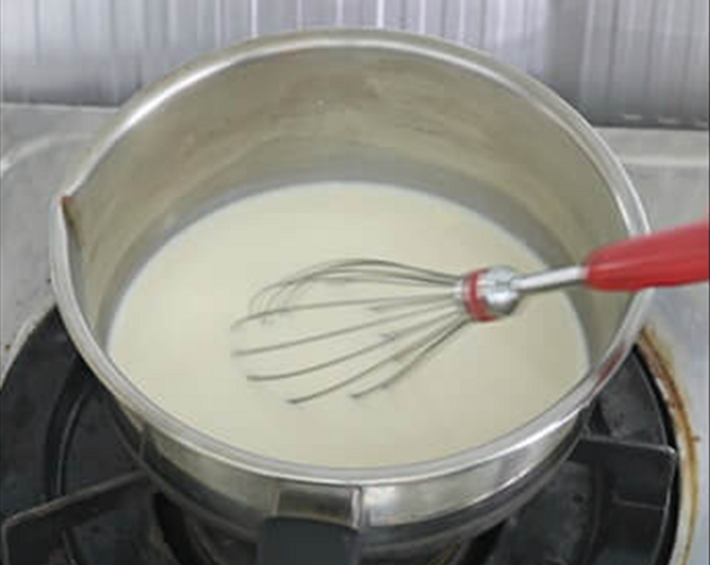 step 1 For the black sesame pudding - In a pot, add the Unsweetened Soy Milk (3/4 cup), Whipped Cream (3 Tbsp), and Caster Sugar (2 1/2 Tbsp) together. Lightly boil the liquid mixture and stir the sugar til dissolved at low heat.