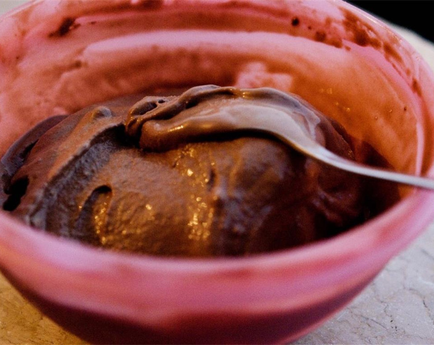 step 8 Next up, soften up the chocolate ice cream and spread on top of the dark chocolate. Sprinkle with reserved 2 tablespoons of cookie crumble and Chopped Nuts (to taste) and freeze 2 hours.