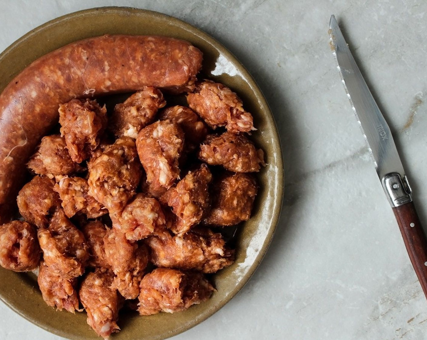 step 14 With a sharp knife, make a slit down the Sausages (3) and remove the meat and break it up into small pieces. Discard the casing. You can also just slice them with the casing on.