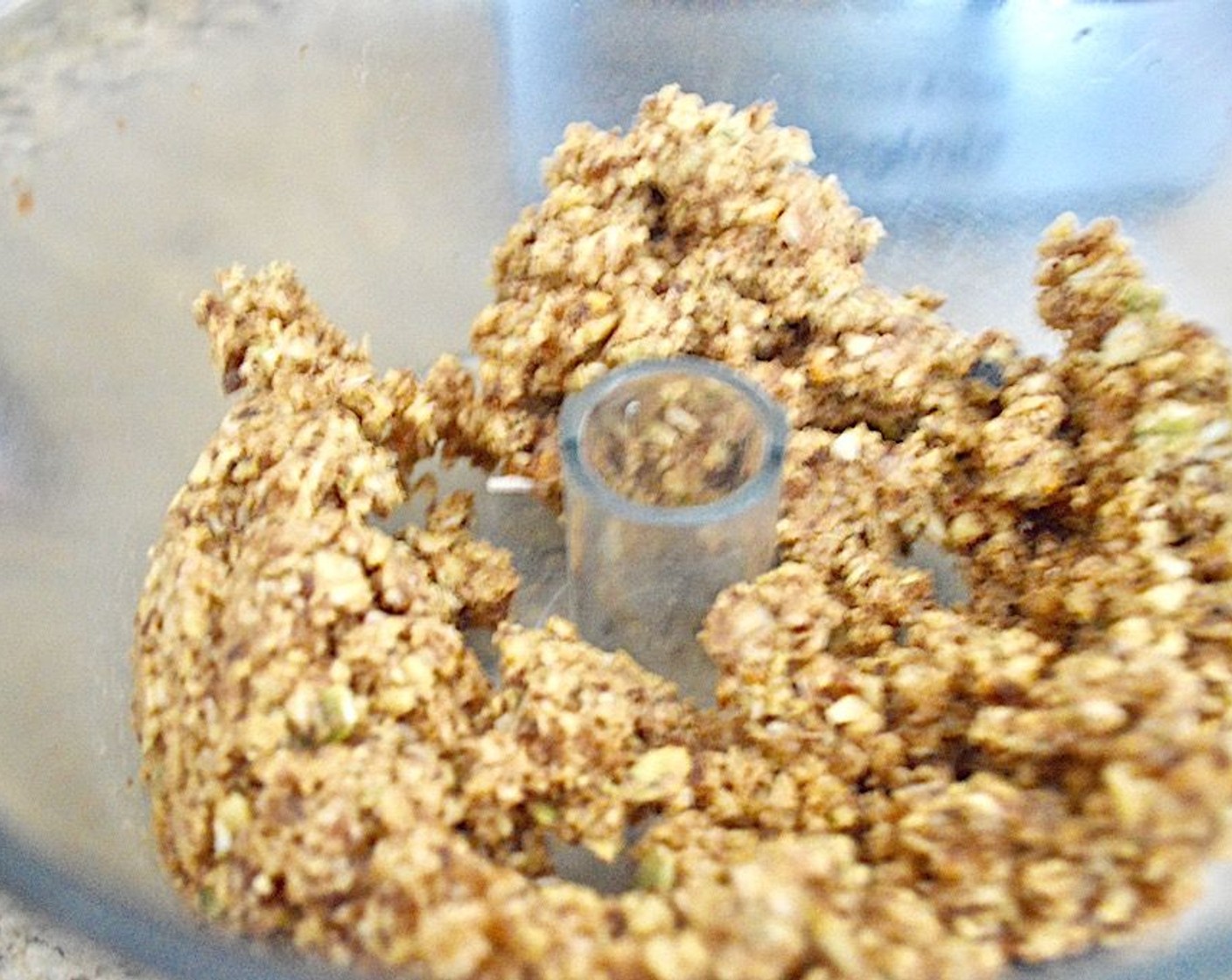 step 2 Into a food processor, add the sweet potato, Pitted Dates (12), Walnut (1 cup), Slivered Almonds (1 cup), Pepitas (4 Tbsp), Unsweetened Shredded Coconut (4 Tbsp), Ground Flaxseed (1 tsp), Simply Organic Cinnamon, Ground (1 tsp), Ground Nutmeg (1/2 tsp), and Vanilla Extract (1/2 tsp). Pulse it together until you have a mixture that is fine but still has some texture.