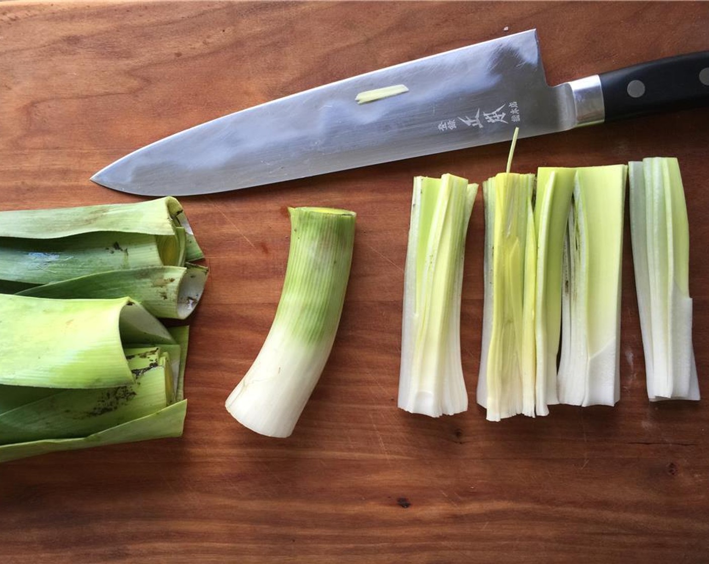 step 1 Slice off the stem and green leaves from the Leeks (2), and quarter them vertically.
