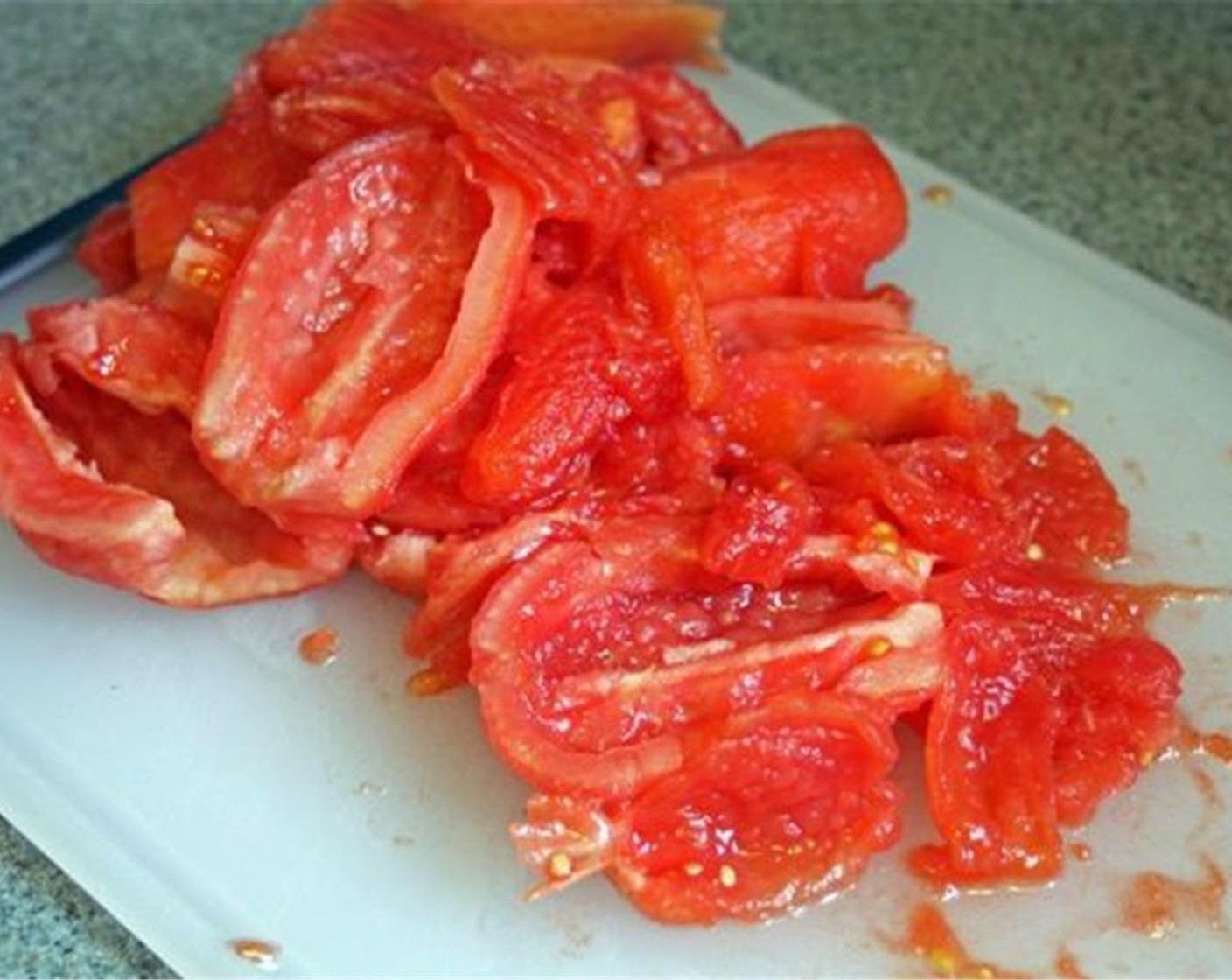 step 6 Slice the tomatoes in half and scoop out the seeds. You should be left with a little over 2 pounds of tomatoes.