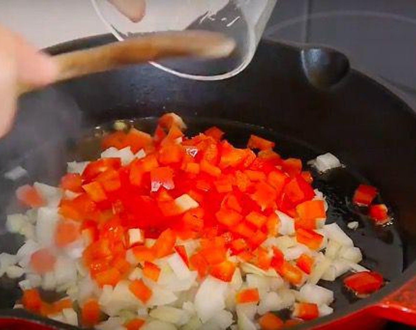 step 2 The first thing we need to do is a classic sofrito so we cook in a hot pan with some Olive Oil (as needed) or vegetable oil the Red Chili Pepper (1) and White Onion (1). Once they are soft, grate the Garlic (4 cloves) and continue to cook for 5 minutes.