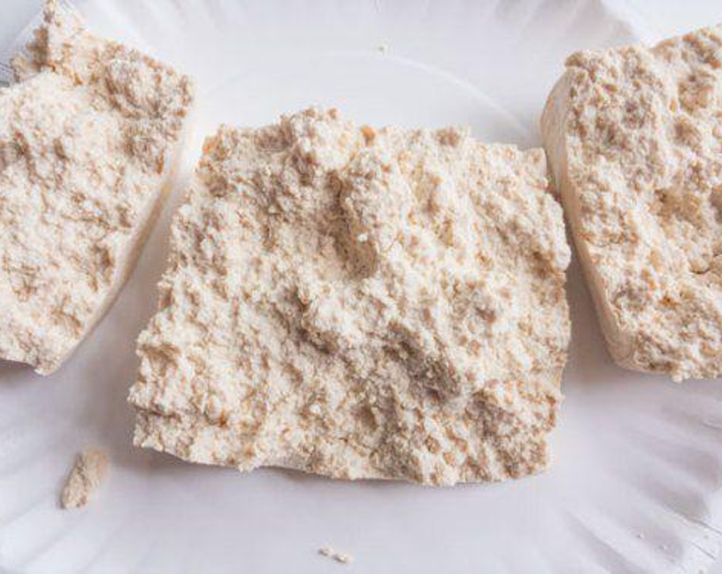step 1 Tear Extra Firm Tofu (1 block) into 3 pieces and press each with paper towels to remove any liquid.