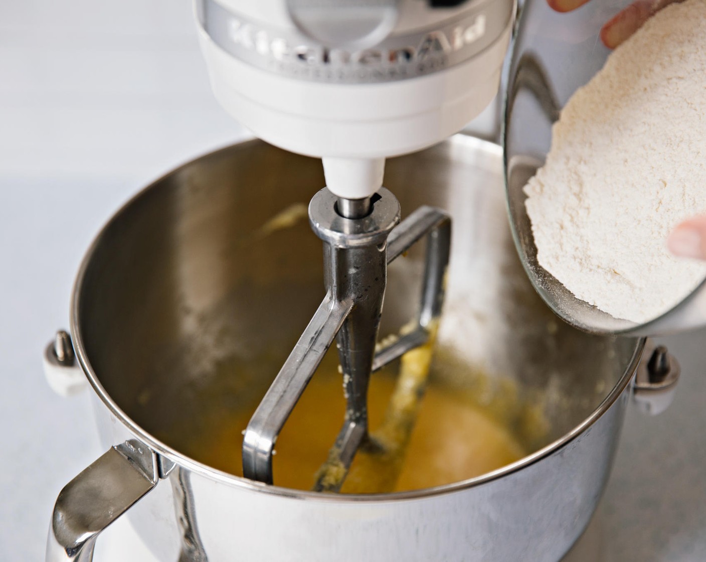 step 10 Gradually add flour mixture, about a cup at a time. Alternate a cup of flour mixture with a third of the buttermilk.