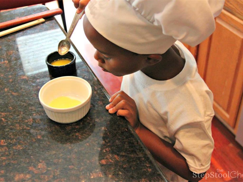 Step 2 of Simple Vanilla Soufflé Recipe: Melt the Salted Butter (2 tablespoon) in the microwave. Pour small portions in the soufflé dishes. Roll the melted butter around including the edges to “butter the dish”.