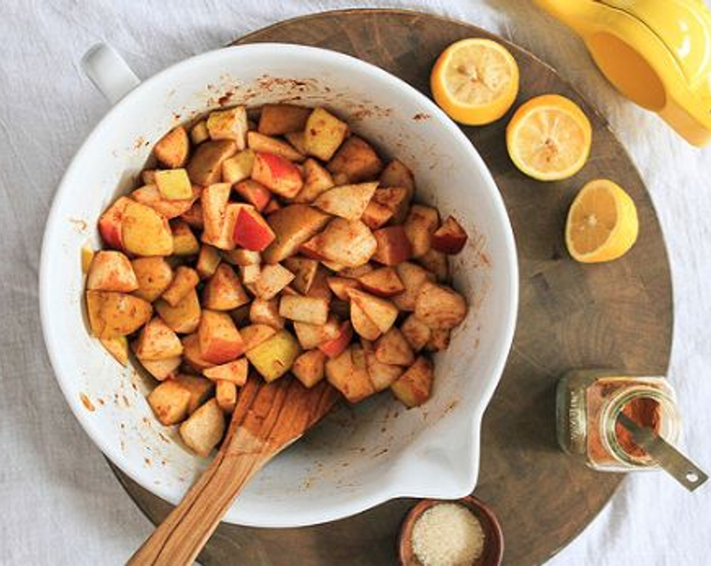 step 2 In a large bowl (or right in your baking dish), combine Apples (3), Pears (3), the juice from Lemon (1), Coconut Sugar (1 Tbsp), and Simply Organic Cinnamon, Ground (1 tsp).
