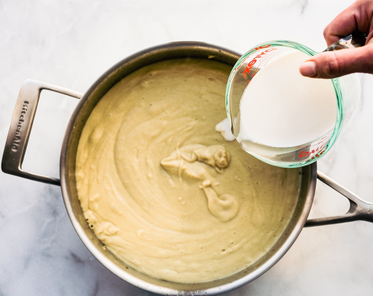 step 7 Add Paprika (1/2 tsp), additional Salt (to taste) and Ground Black Pepper (to taste), Almond Milk (3/4 cup), Grated Parmesan Cheese (1 cup), and Plain Greek Yogurt (1 cup). Simmer for 5-10 minutes until creamy and combined.