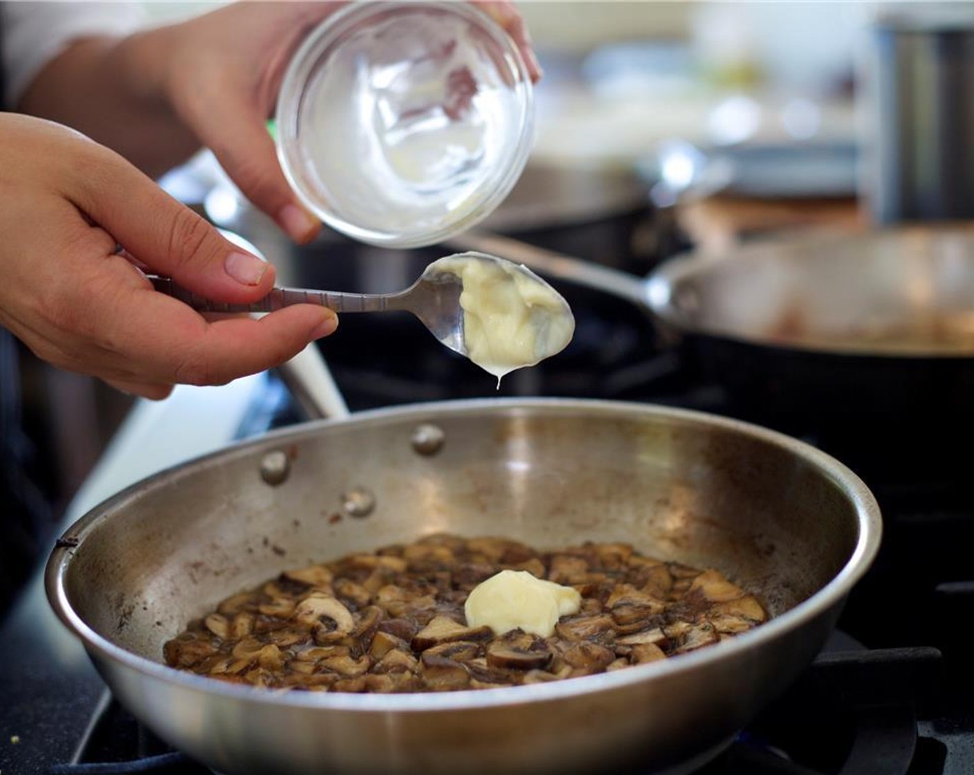 step 19 Meanwhile, heat a medium sauté pan over medium high heat. Add Oil (2 Tbsp) and Garlic (2 cloves). Saute for 1 minute.
