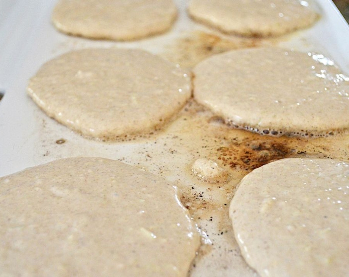 step 4 Get out an electric griddle and heat it to 350 degrees F (176 degrees C), then grease it with Butter (to taste). Scoop out the desired portions of batter onto the griddle and cook the pancakes for 3-4 minutes on each side, until golden and puffy.