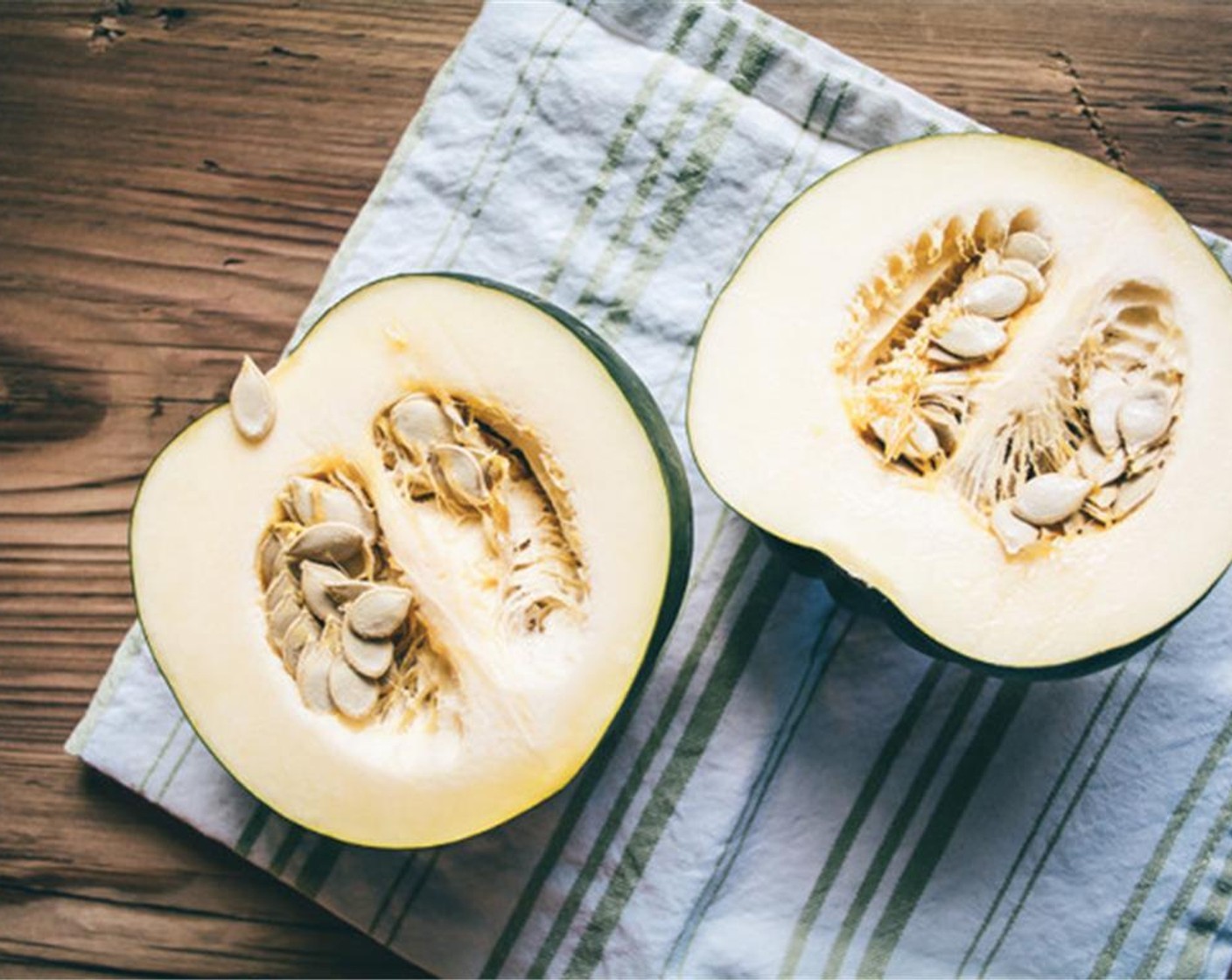 step 2 While oven heats, cut Acorn Squash (1) in half, remove seeds, then cut criss-cross patterns over each squash half, careful not to cut the skin. Bake Squash on baking sheet for 25 to 30 minutes, or until flesh is cooked through.