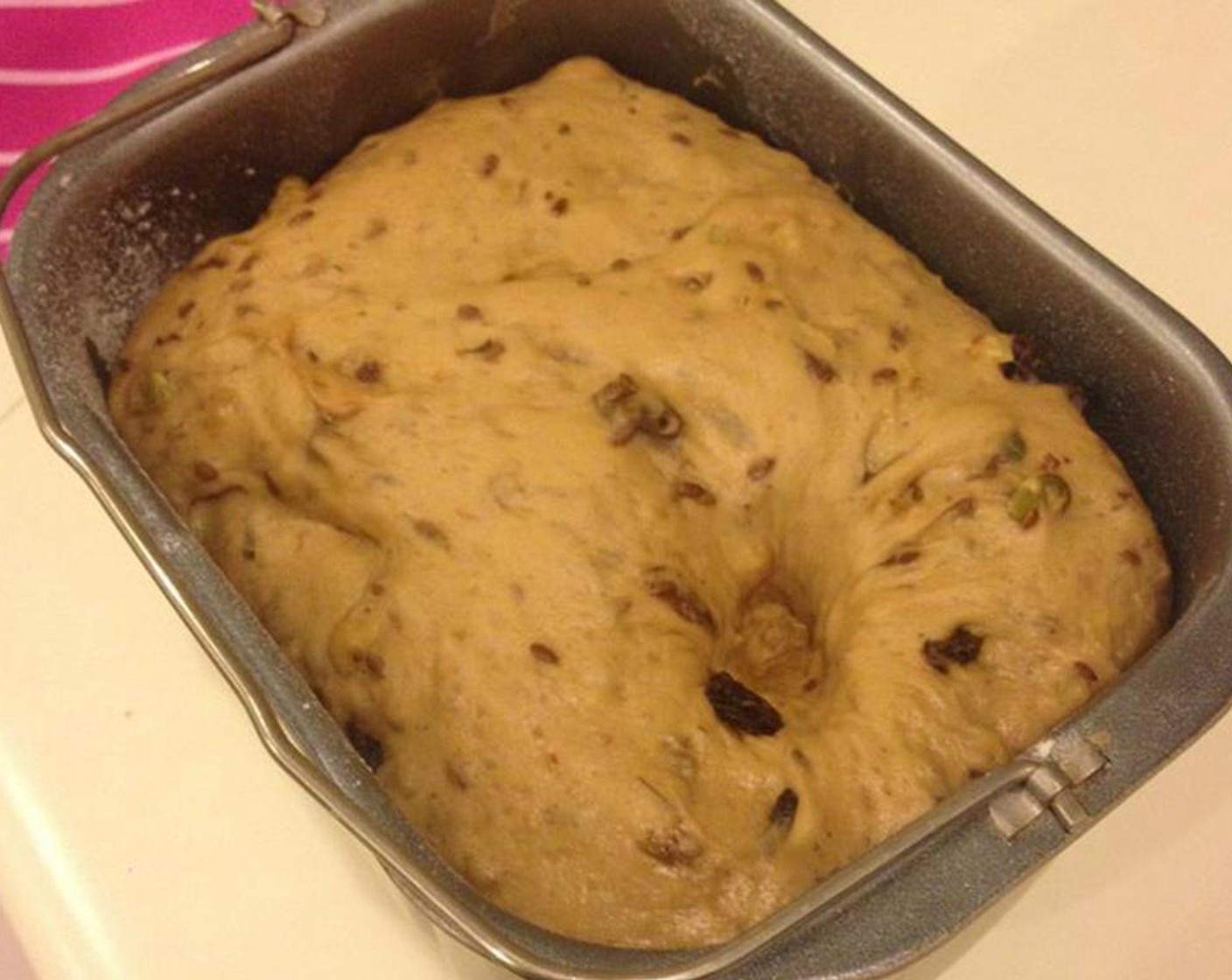 step 3 Knead until it becomes gluten develops and it becomes a dough. Gently roll in half of the nuts and seeds - Sultanas (1/4 cup), Flaxseeds (1 Tbsp), Pepitas (2 Tbsp), and Walnut (1/3 cup). Cover with wet towel until it doubles in size, about 45-60 minutes.