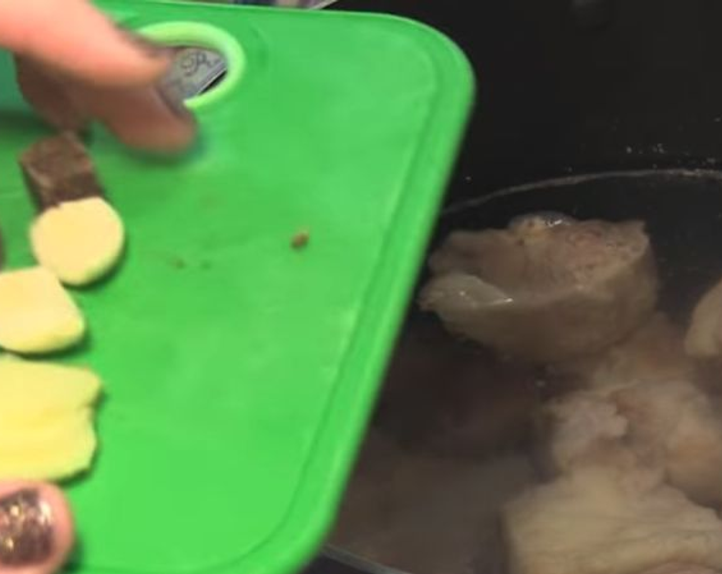 step 2 With a ladle, carefully skim off the scum. Add the Beef Bouillon Cubes (3), Garlic (2 cloves), and Fresh Ginger (1/2 in).