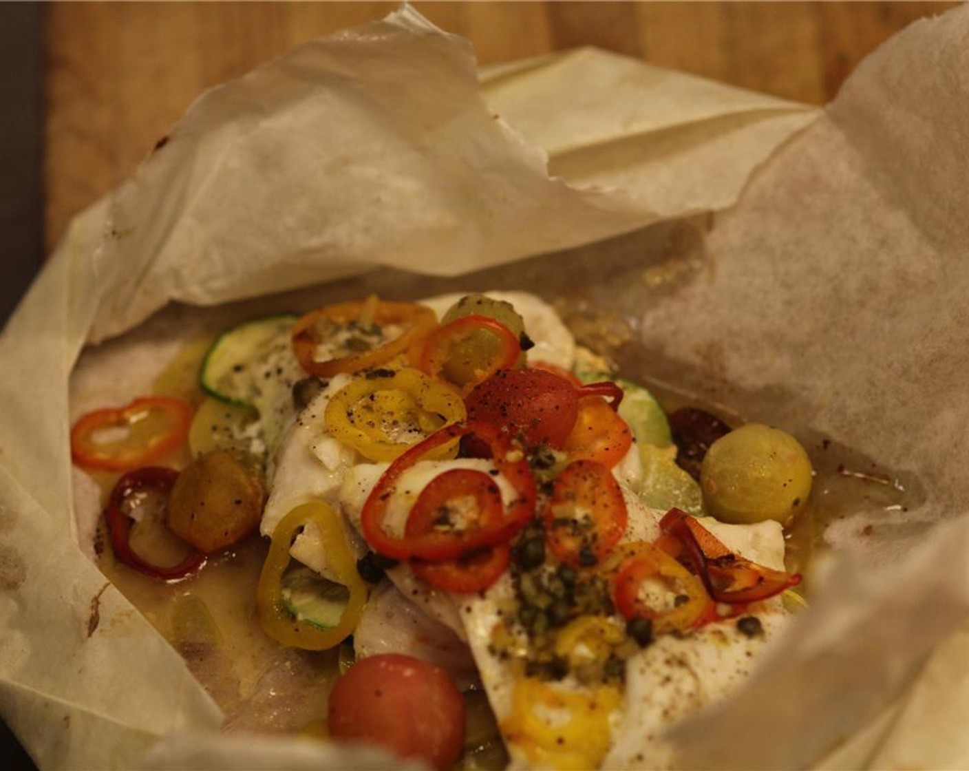 step 14 To serve, cut open the packets and serve directly in the parchment on a plate.