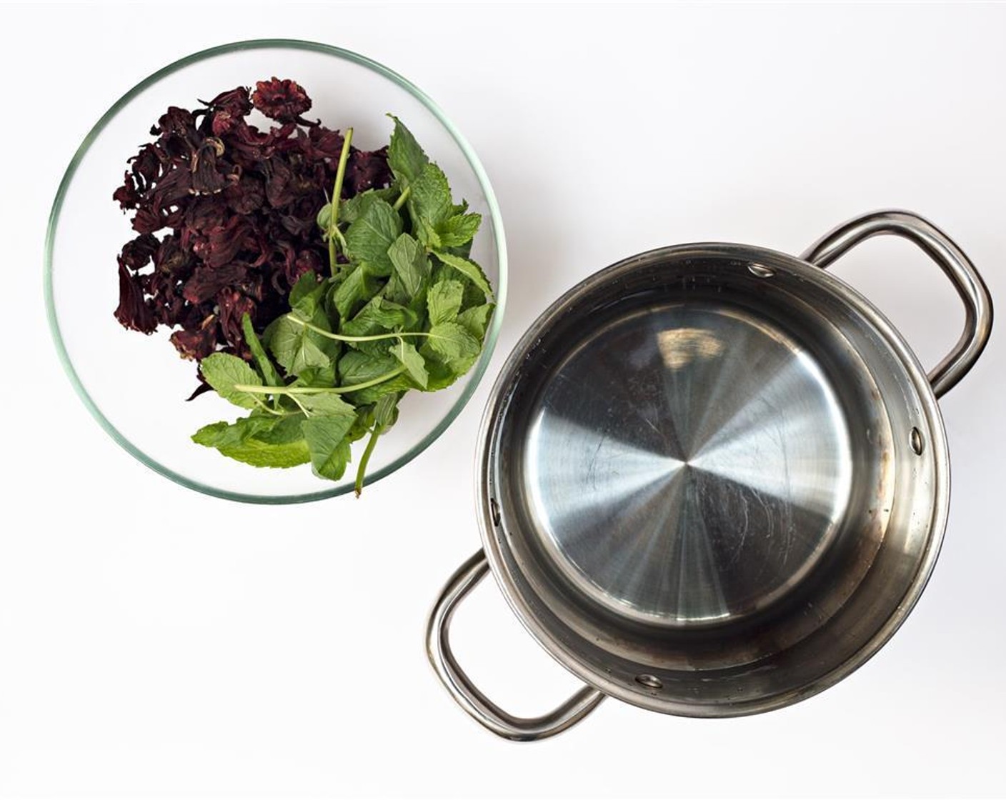 step 1 Wash the Roselle Leaves (1 handful) and Fresh Mint Leaves (1 handful) and put them in a bowl. Boil the Water (720 mL) and pour it on the leaves. Let it cool down.