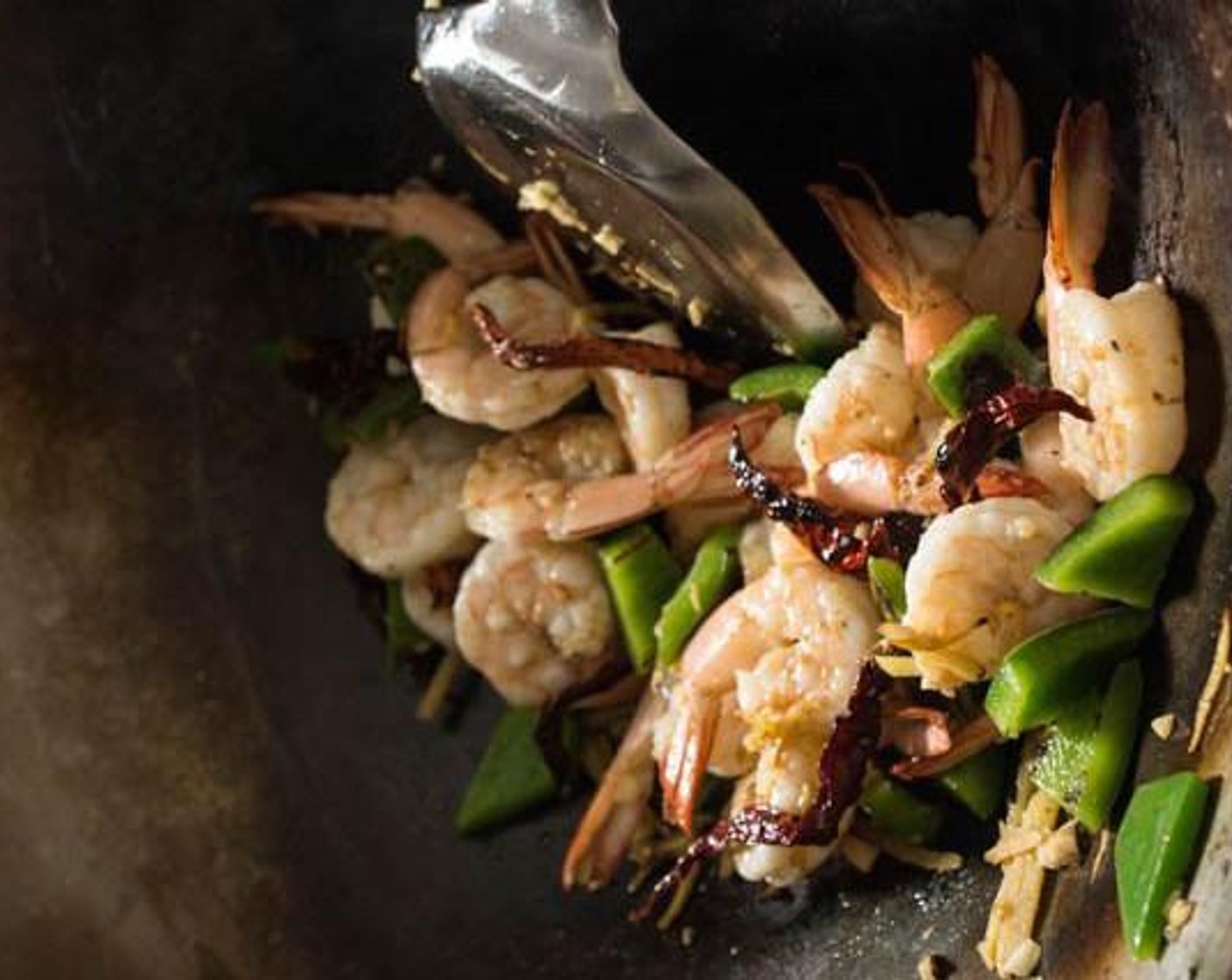 step 4 Add the Shrimp (1 lb), spreading them in a single layer. Cook the bottom side of the shrimp, then flip and stir-fry them for about 1 minute or until fully cooked.