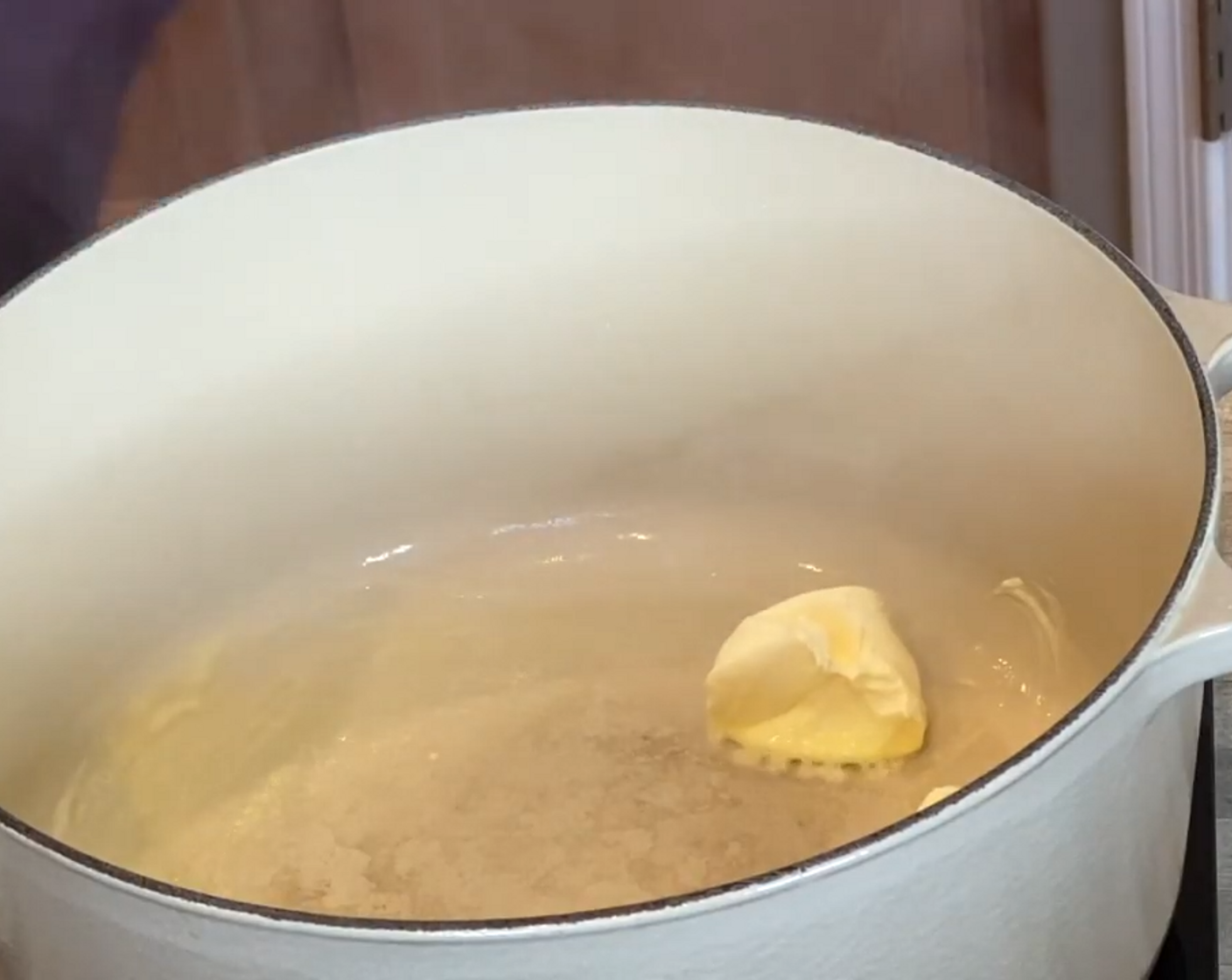step 2 Melt Butter (4 Tbsp) in a large Dutch oven over medium-high heat. Add Onion (1/3 cup) and Garlic (2 cloves) and cook for a few minutes, until onions are soft.