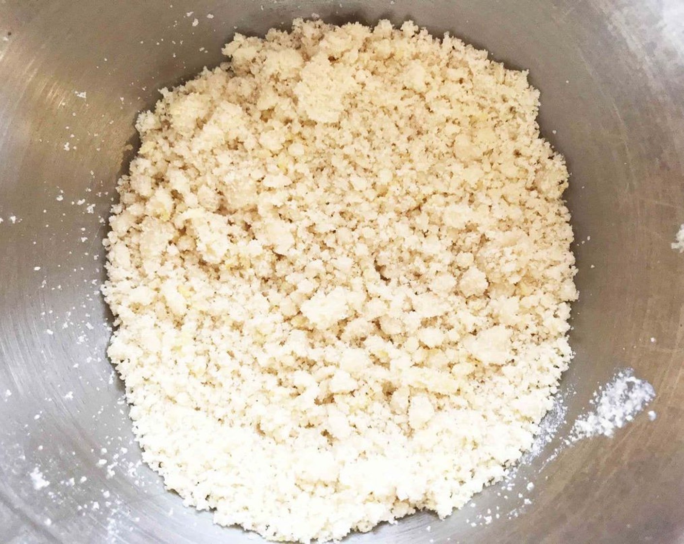 step 8 In a medium bowl, mix together the melted butter, Almond Flour (2/3 cup), Natural Sweetener (2 Tbsp), lemon zest and Vanilla Extract (1/2 tsp) until crumbly.
