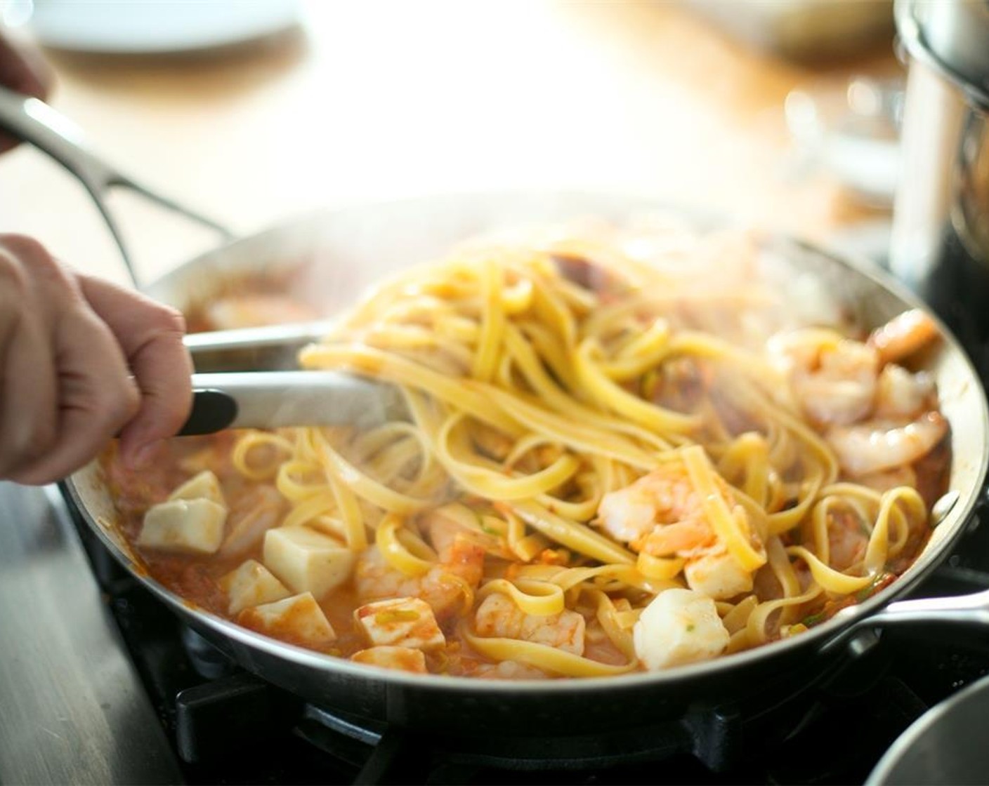 step 13 Reduce the temperature of the sauce to low. Add pasta, shrimp, and Fresh Mozzarella Cheese Ball (3/4 cup). Toss just until the cheese is heated through but not melted. Turn heat off, remove shrimp for easier plating.