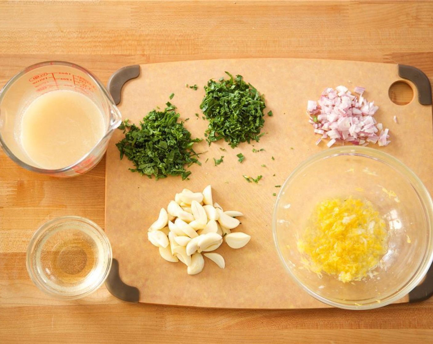 step 2 In a bowl, stir Chicken Base (1 pckg) with 1 cup of warm water. Slice the Garlic (20 cloves) in half lengthwise. Finely chop the Shallot (1). Finely chop Fresh Parsley (3 Tbsp), into a bowl. Juice Lemon (1) into the bowl with zest.