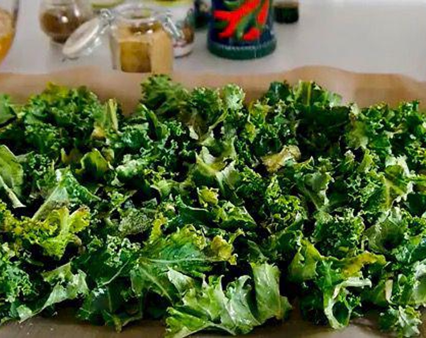 step 4 Put Kale (4 cups) on a baking tray lined with parchment. Add Olive Oil (as needed), Salt (to taste), and Ground Black Pepper (to taste) and mix well with your hands. Roast for 10 minutes in the oven. Once done remove it from the tray and place it on a dry plate.