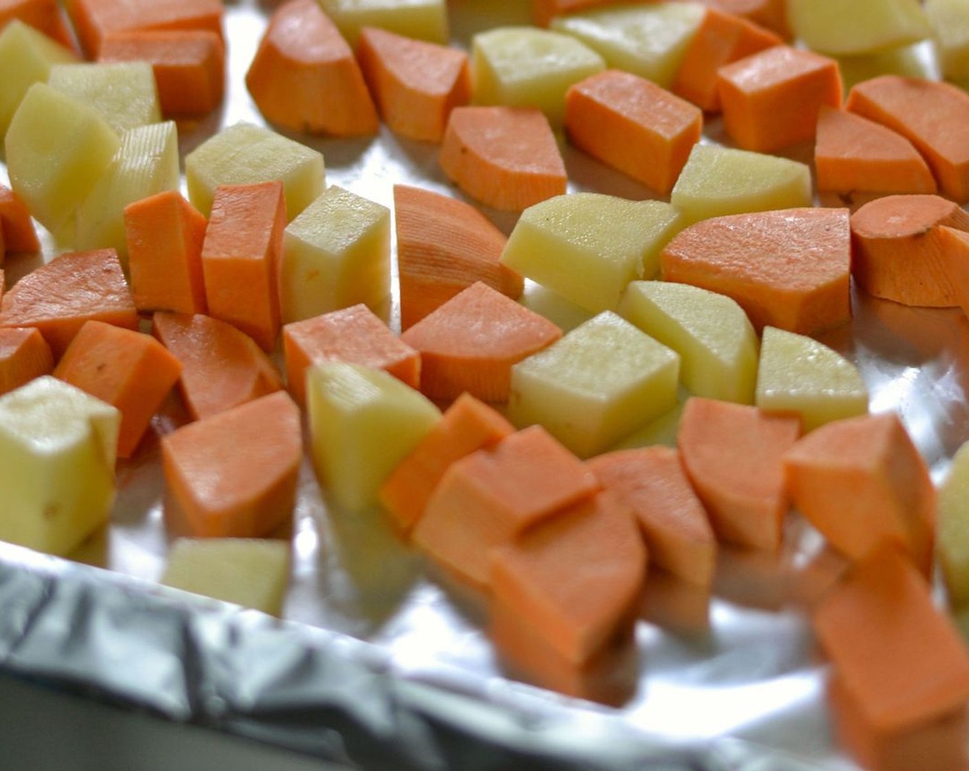 step 1 Preheat oven to 430 degrees F (220 degrees C) and line a large baking sheet with foil (you don’t have to, but it makes cleanup much easier). Spray it with oil and then add Potatoes (2) and Sweet Potato (1).