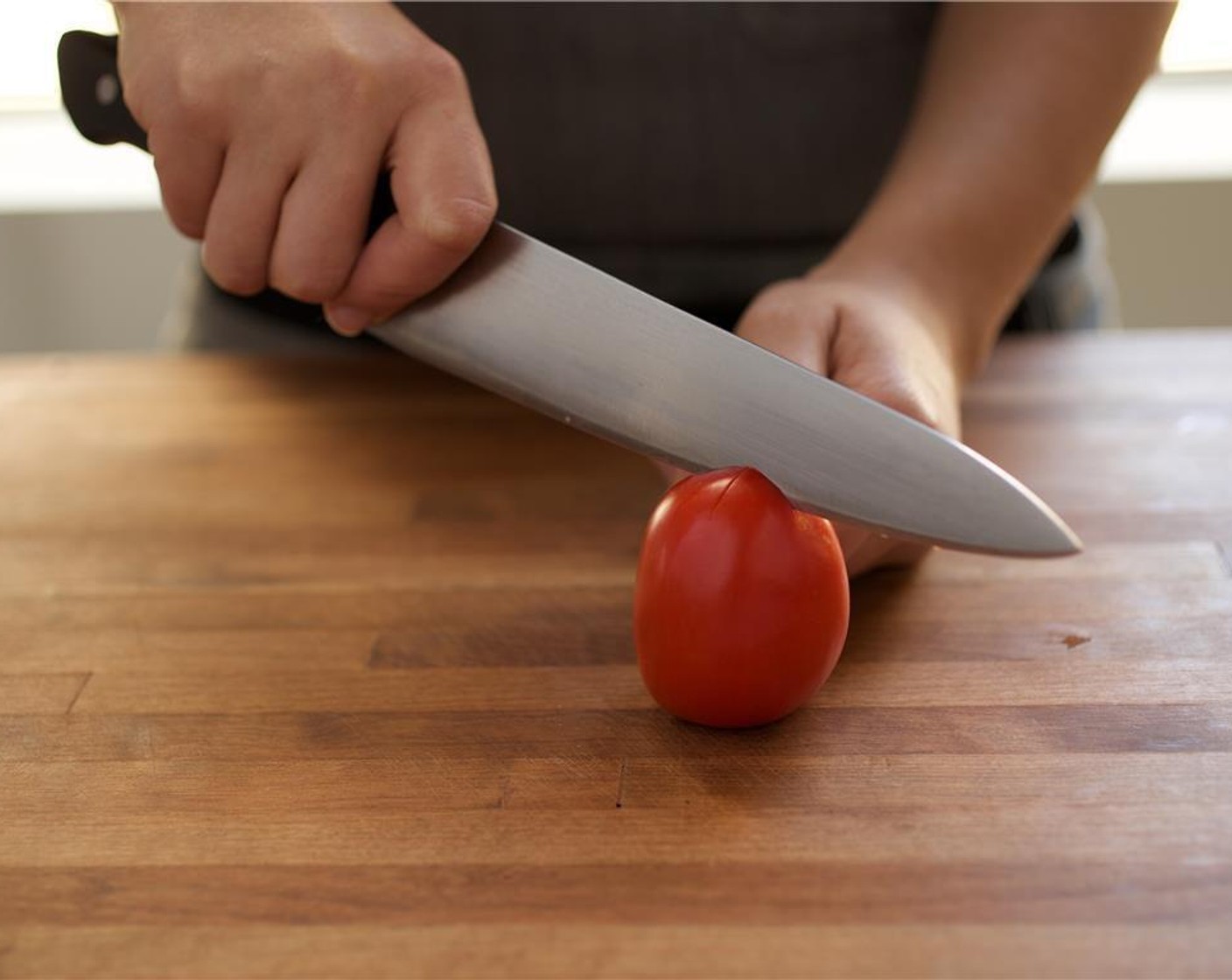 step 3 Cut (score) a two inch x, centered, on the bottom end of the Roma Tomato (1).