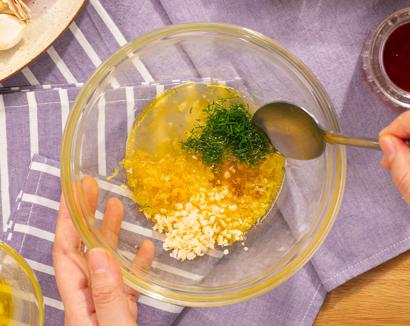 step 4 In a small mixing bowl, combine Butter (2 Tbsp), 1 1/2 Tbsp of Lemon (1), Honey (1/2 Tbsp), Garlic (2 cloves), 1/2 Tbsp of Lemon Zest, and Fresh Dill (1 Tbsp) together.