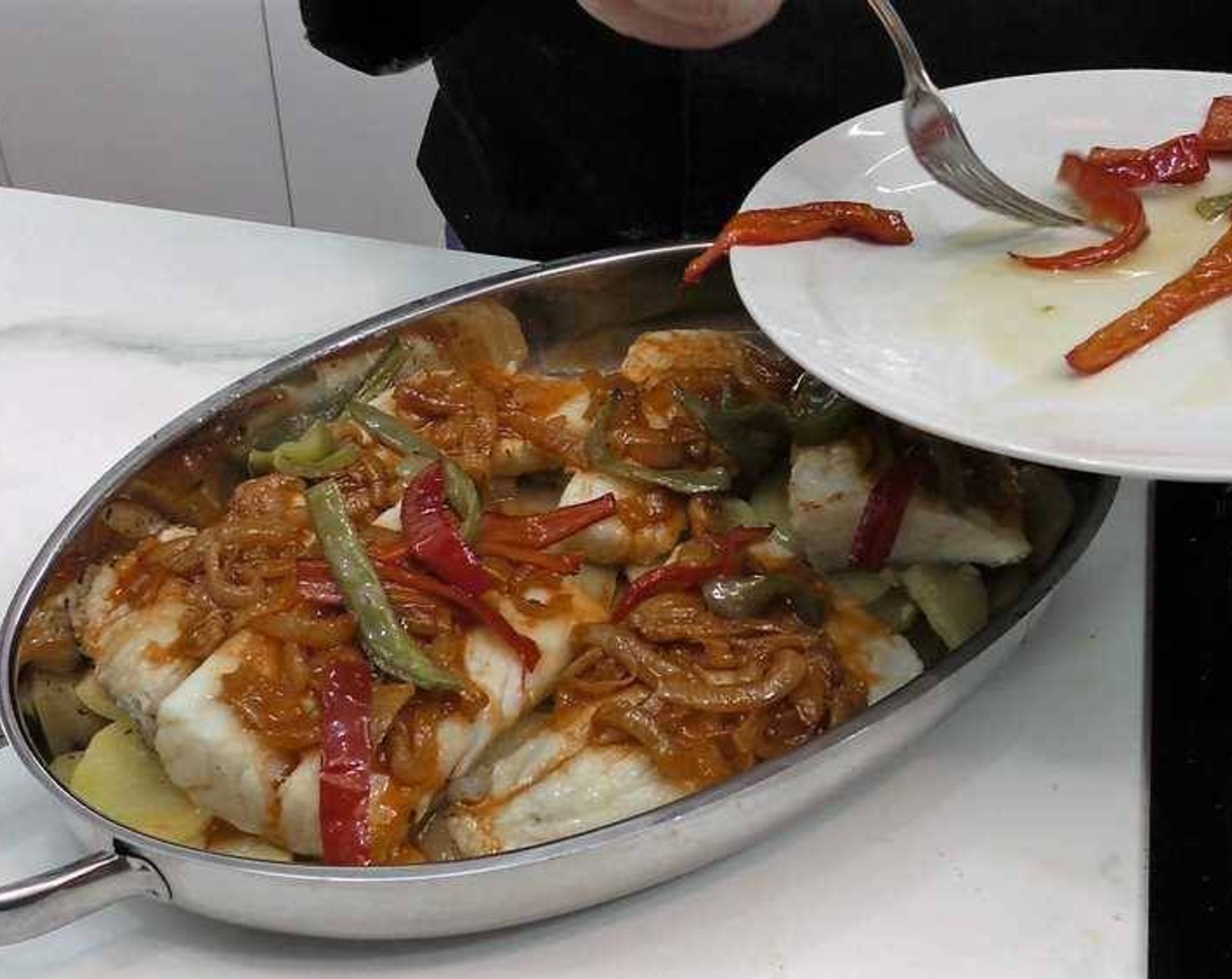 step 14 Next we layer the onion and garlic mixture followed by the green and red bell pepper mixture on top.