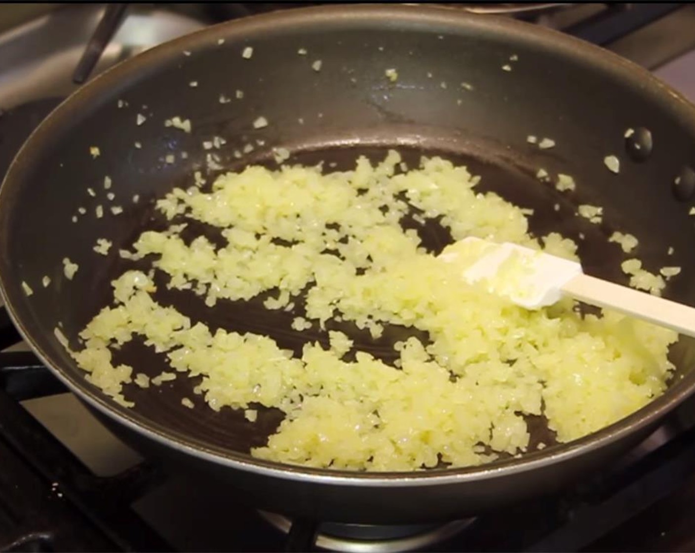 step 2 In a large, nonstick frying pan, heat Olive Oil (3 Tbsp) over medium low heat. Add the chopped onion, and saute for 5 minutes.