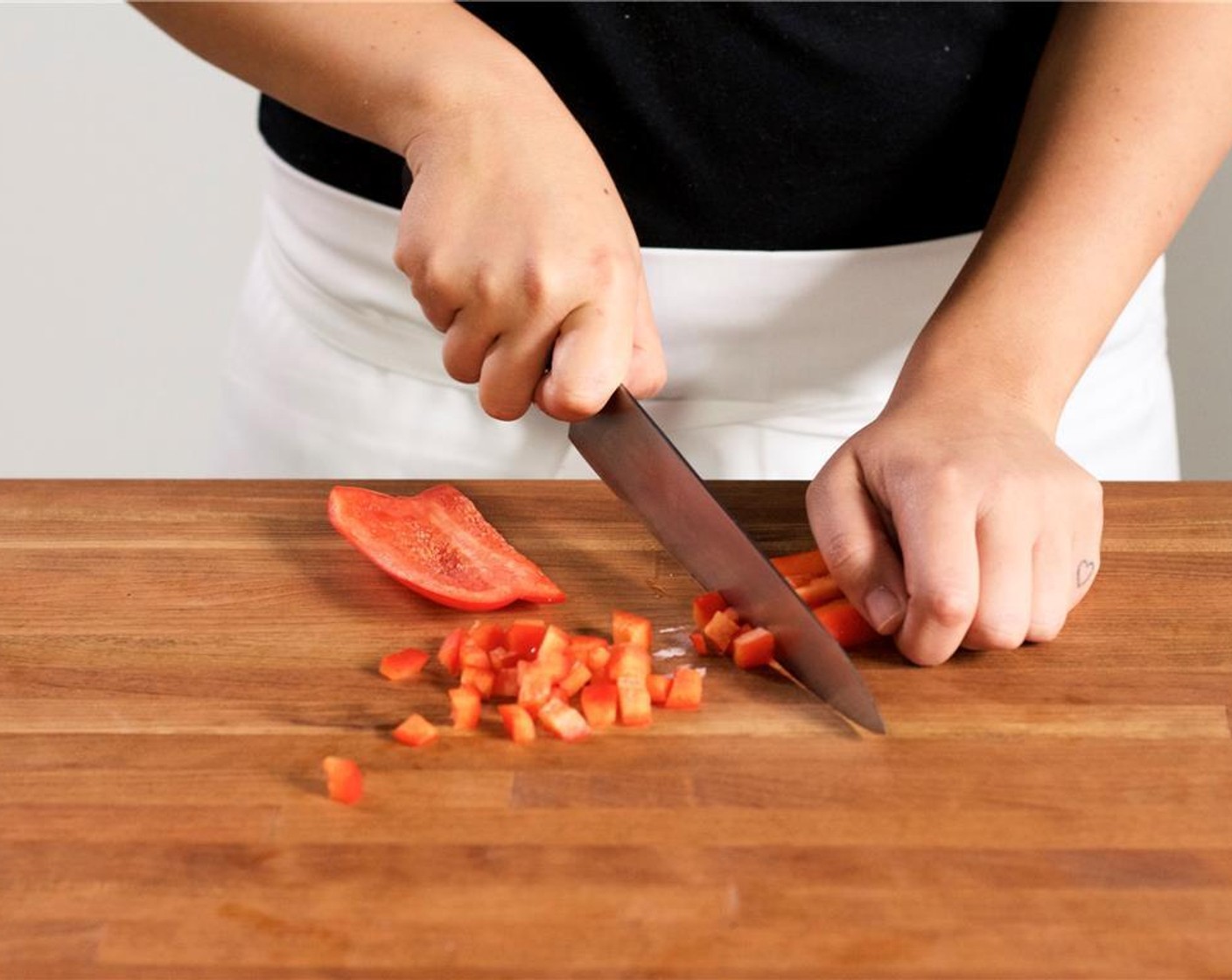 step 2 Peel Onion (1/2 cup) and chop half cup into quarter-inch diced pieces. Place in a medium bowl. Remove the stem, pith, and seeds from the Red Bell Pepper (1/2). Slice into quarter-inch diced pieces and add to the onion bowl.