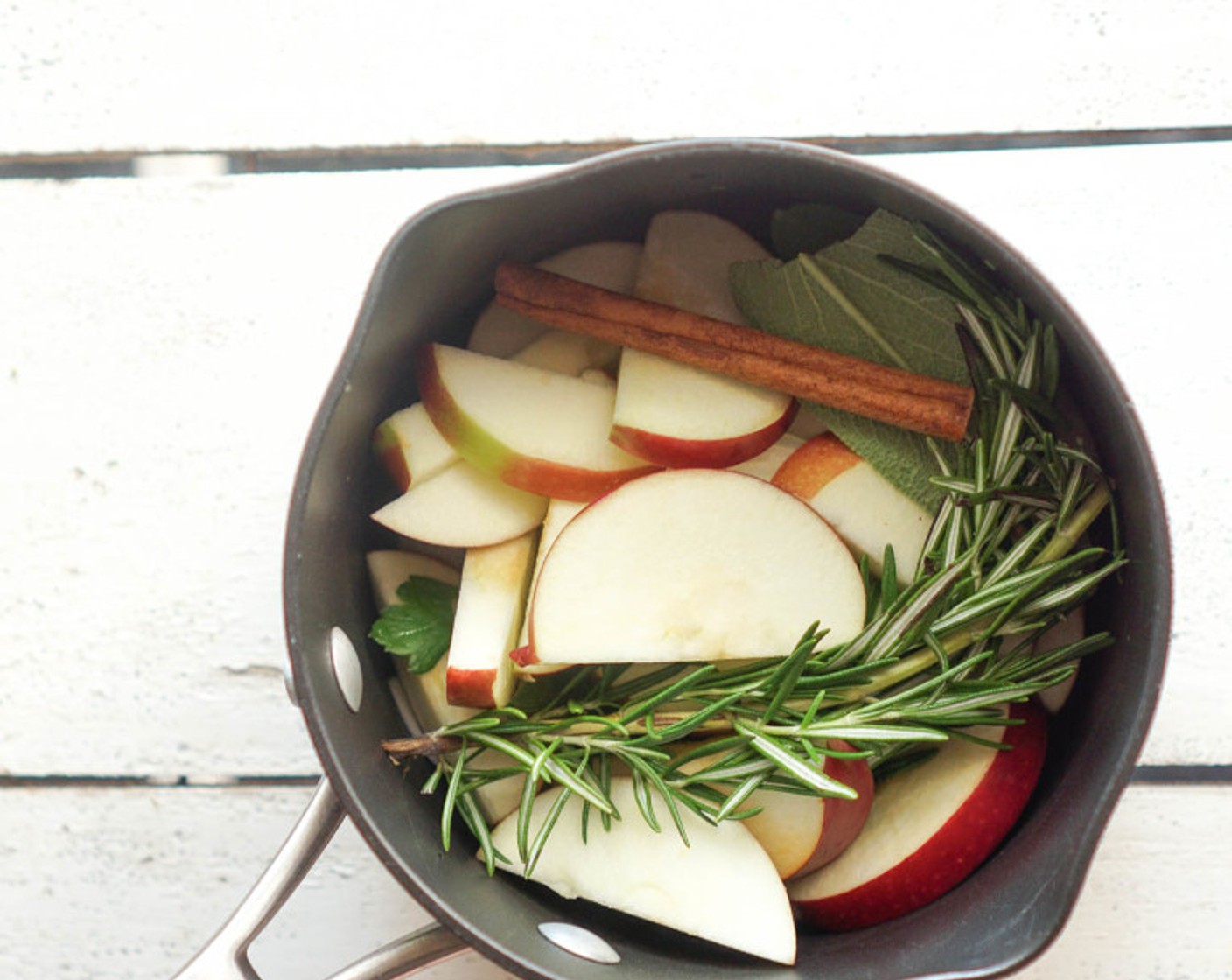 step 8 Prepare the aromatics. Combine the Red Apple (1), Onion (1/2), Cinnamon Stick (1) and Water (1 cup) and microwave for 5 minutes. Remove the solids (discard the water) and combine with the Fresh Rosemary (2 sprigs) and Sage Leaves (6). Stuff inside the turkey cavity.