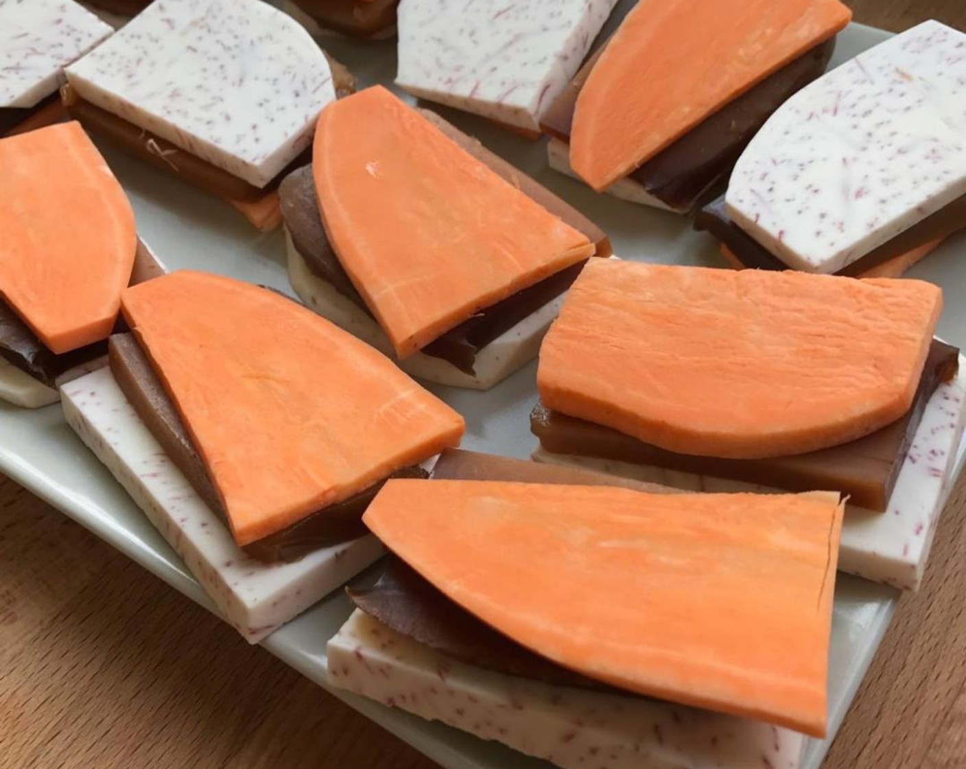 step 2 Sandwich each sticky rice cake with a slice of yam and a slice of sweet potato. Then set aside while we prepare the batter.