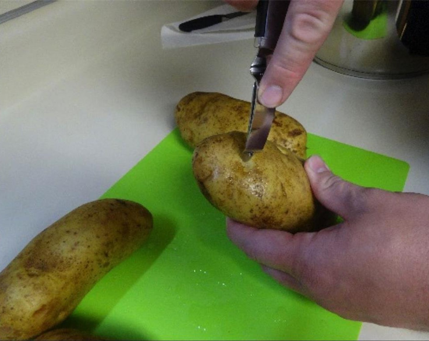 step 1 Thoroughly wash the Potatoes (4) and remove any eyes the potatoes might've grown, but keep the potato peel on.