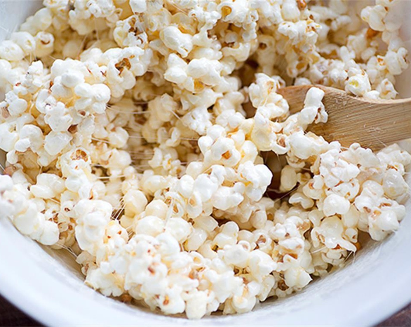 step 3 Carefully combine the hot mixture with the Popcorn (20 cups),  coating each kernel.