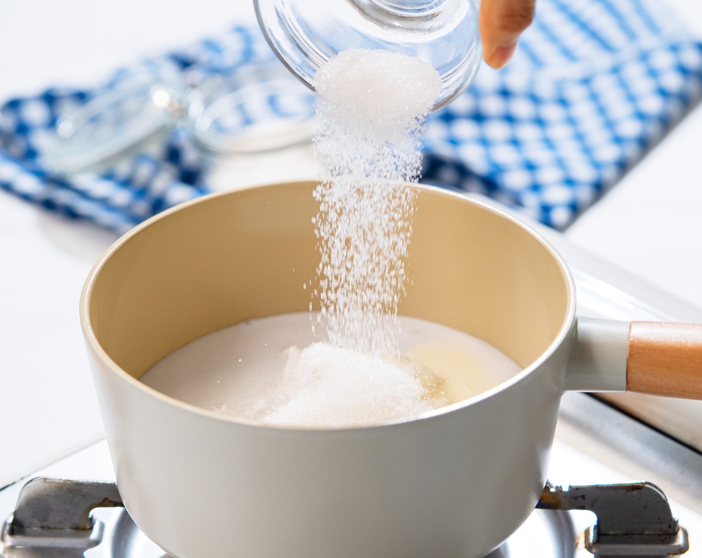 step 2 In a sauce pot, combine the Coconut Milk (1 cup), Coconut Cream (1/2 cup), Cream (1/4 cup), Milk (1/2 cup), Granulated Sugar (3 Tbsp), and Vanilla Extract (1/2 tsp). Set over medium heat and bring to a simmer. Heat until the sugar has dissolved. Remove from the heat and allow to cool for about 5 minutes.