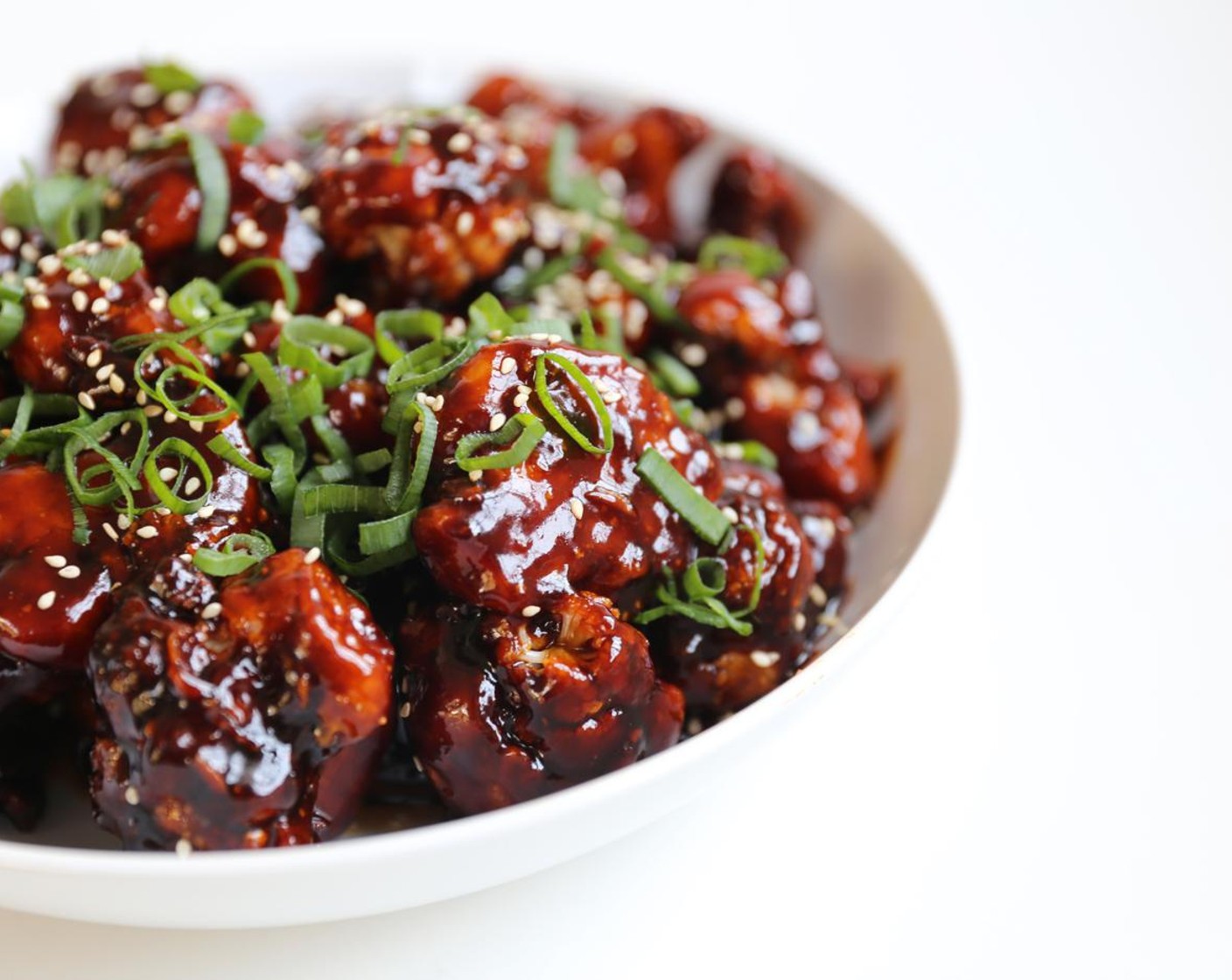 step 13 Add popcorn cauliflower to a serving dish and finish off with White Sesame Seeds (to taste) and Scallions (to taste) Serve warm.