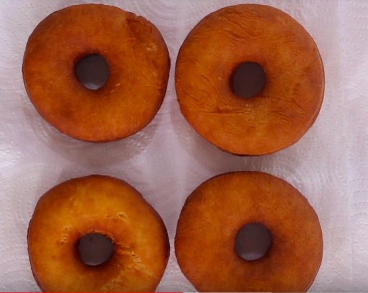 step 8 Place the donuts in batches to fry for 3-4 minutes, turning occasionally. Drain on paper towels as finished.
