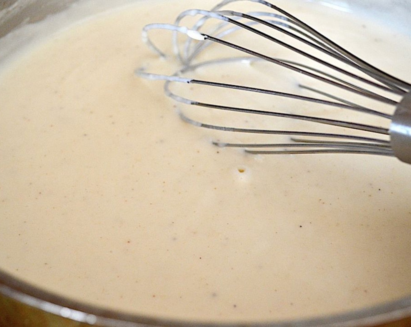 step 6 Slowly pour in the Milk (3 cups) while you keep whisking to bring the béchamel sauce base together. Season it with Salt (to taste) and Ground Nutmeg (1/4 tsp). Reduce the heat to low and let it bubble and thicken for 10 minutes, whisking it often.