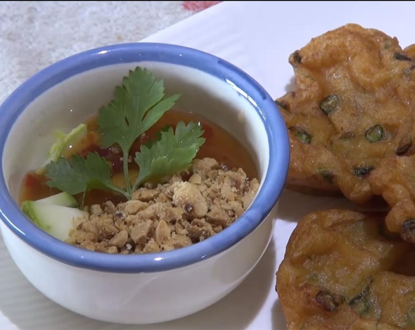 step 8 For the dipping sauce, combine the cucumber, Red Curry Paste (1/2 Tbsp), chopped peanuts and Sweet Chili Sauce (1 cup). Serve and enjoy the fish cakes hot!