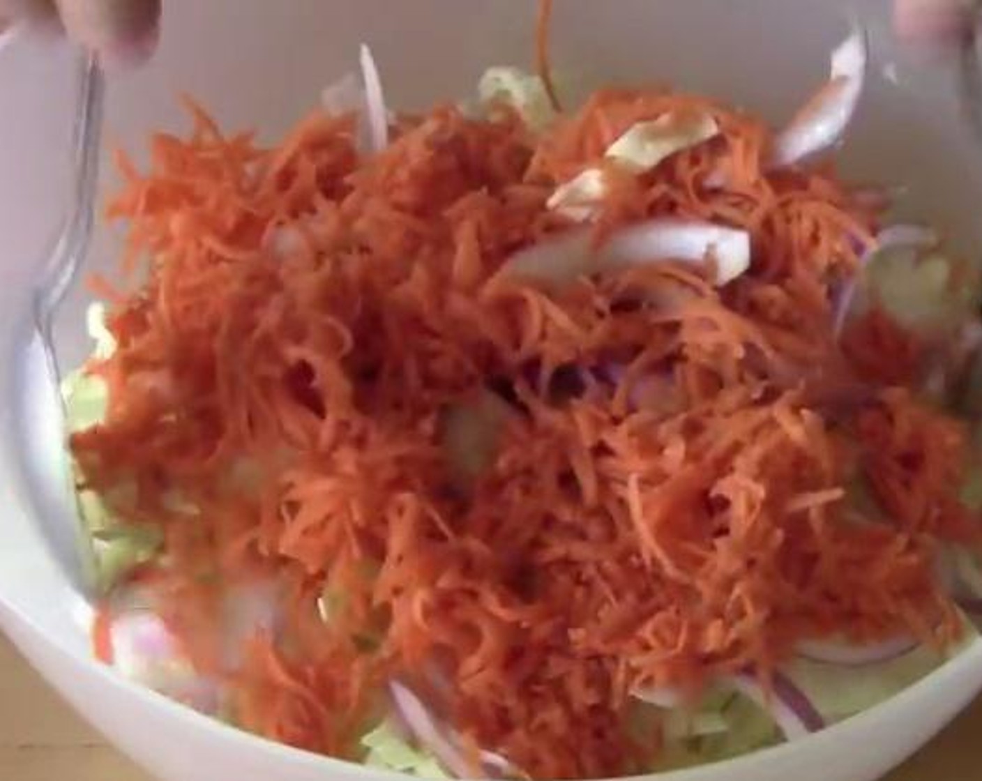 step 1 Into a bowl, add and mix the Green Cabbage (1/2), Red Onion (1/2), and Carrots (2)
