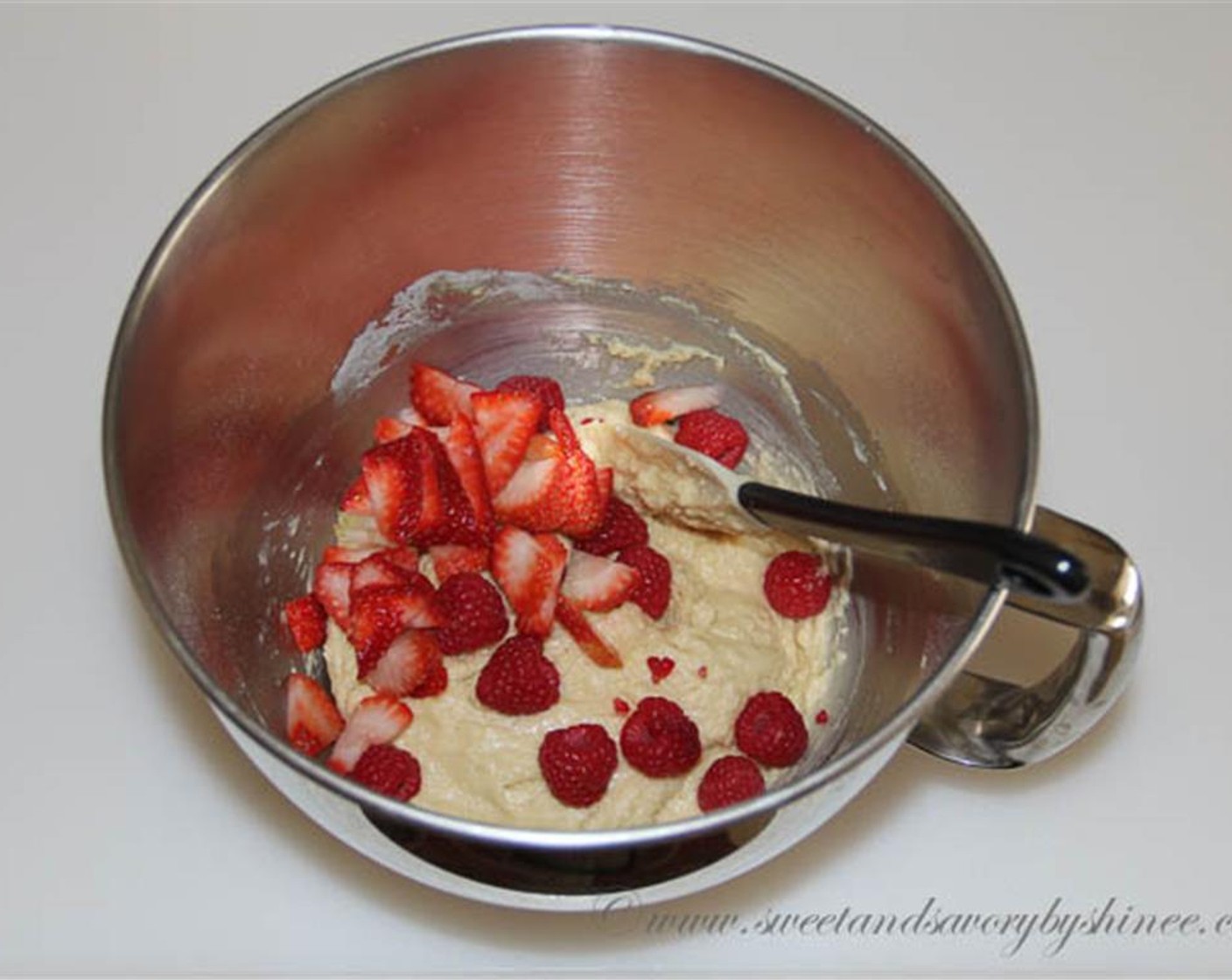 step 4 Add the flour mixture and mix just until combined about a minute. Stir in strawberries and Fresh Raspberry (1/2 cup).