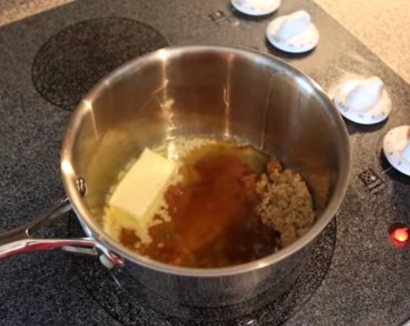 step 5 In a small saucepot over medium heat add Salted Butter (1/2 cup), Brown Sugar (1/4 cup), Honey (2 1/2 Tbsp), Bourbon (2 fl oz), and Dijon Mustard (1 Tbsp). Stir until combined and reduce by half about 8 minutes. Remove from heat and allow to cool.