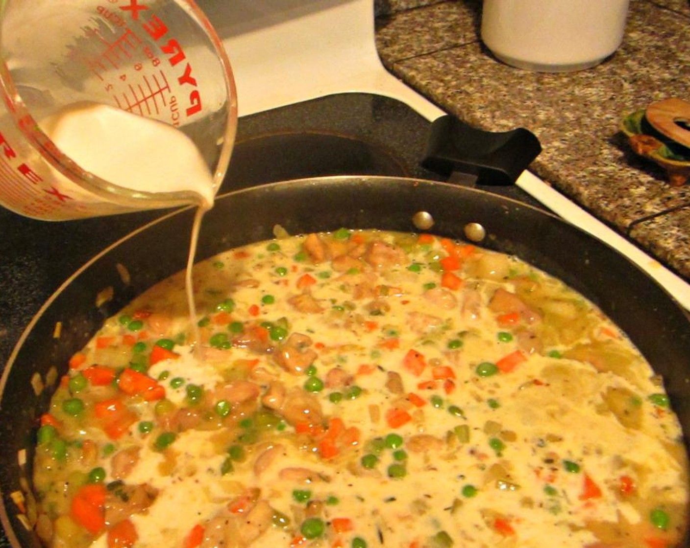 step 4 Sprinkle All-Purpose Flour (1/2 cup), on top of veggies and chicken, stir in completely and cook for another 2 to 3 minutes, until you notice some thickening. Add Low-Sodium Chicken Broth (2 cups), and White Wine (1/2 cup), and stir until the broth starts to thicken and there are no lumps.