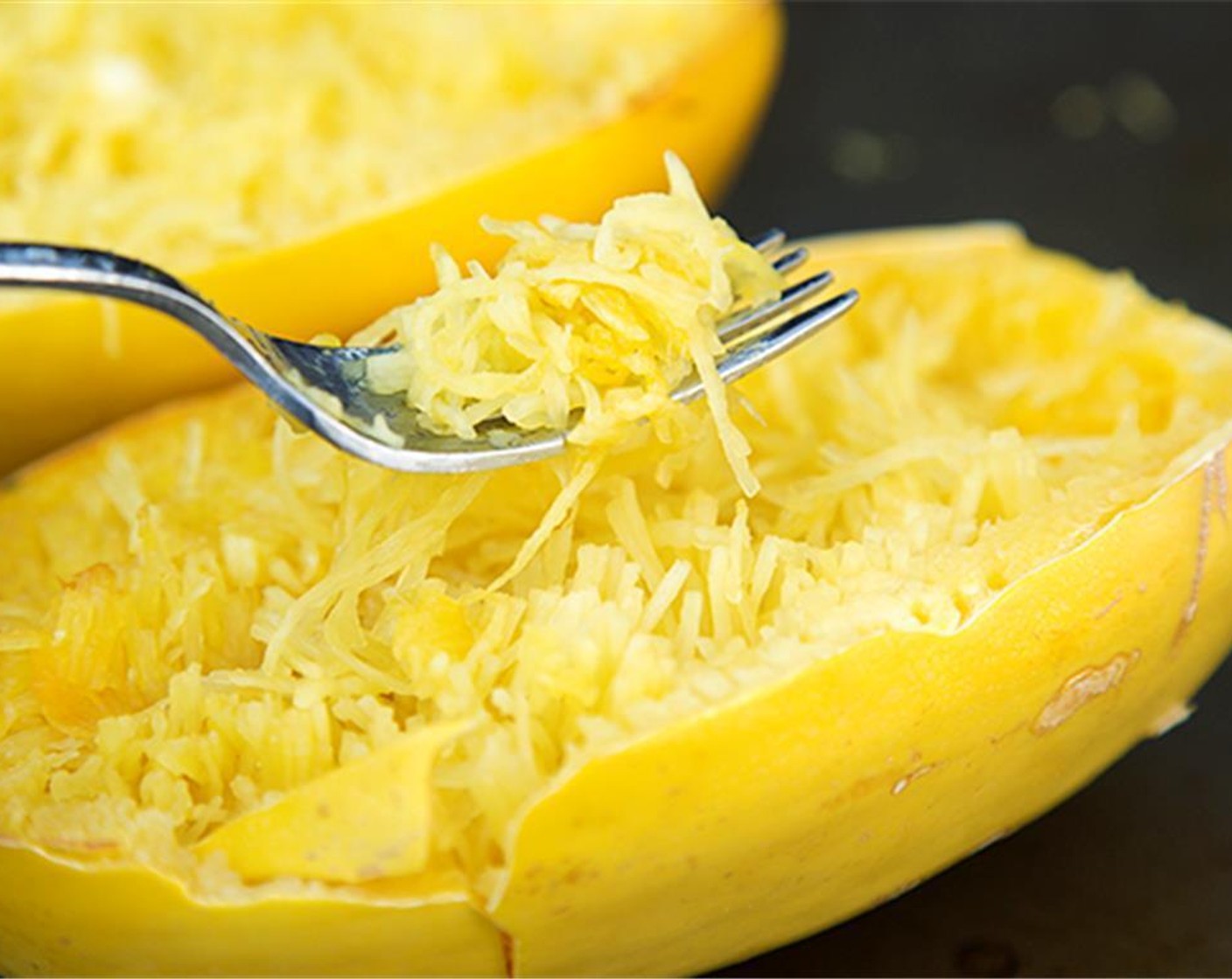 step 6 When the spaghetti squash is cool enough to handle, use a fork to scrape the noodle like strands into the bowl, mix well.