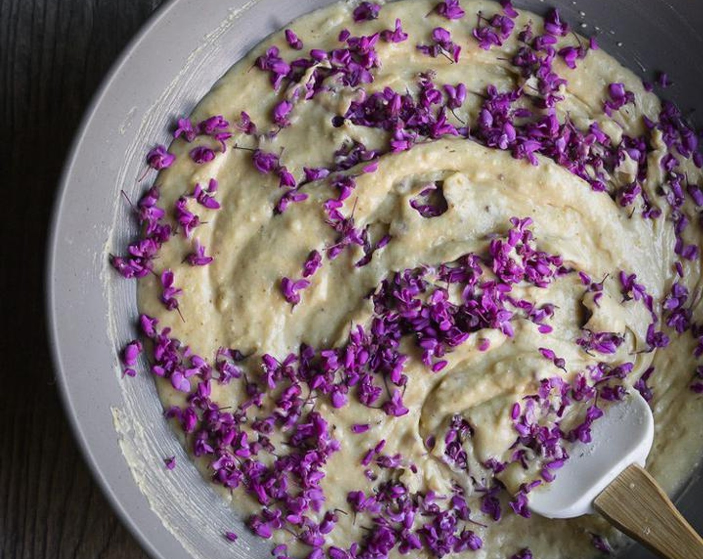 step 5 Using a rubber spatula, fold the wet ingredients into the dry ingredients mixing until just blended. Add the Redbud Flowers (1 1/2 cups) to the batter and gently fold until just incorporated.