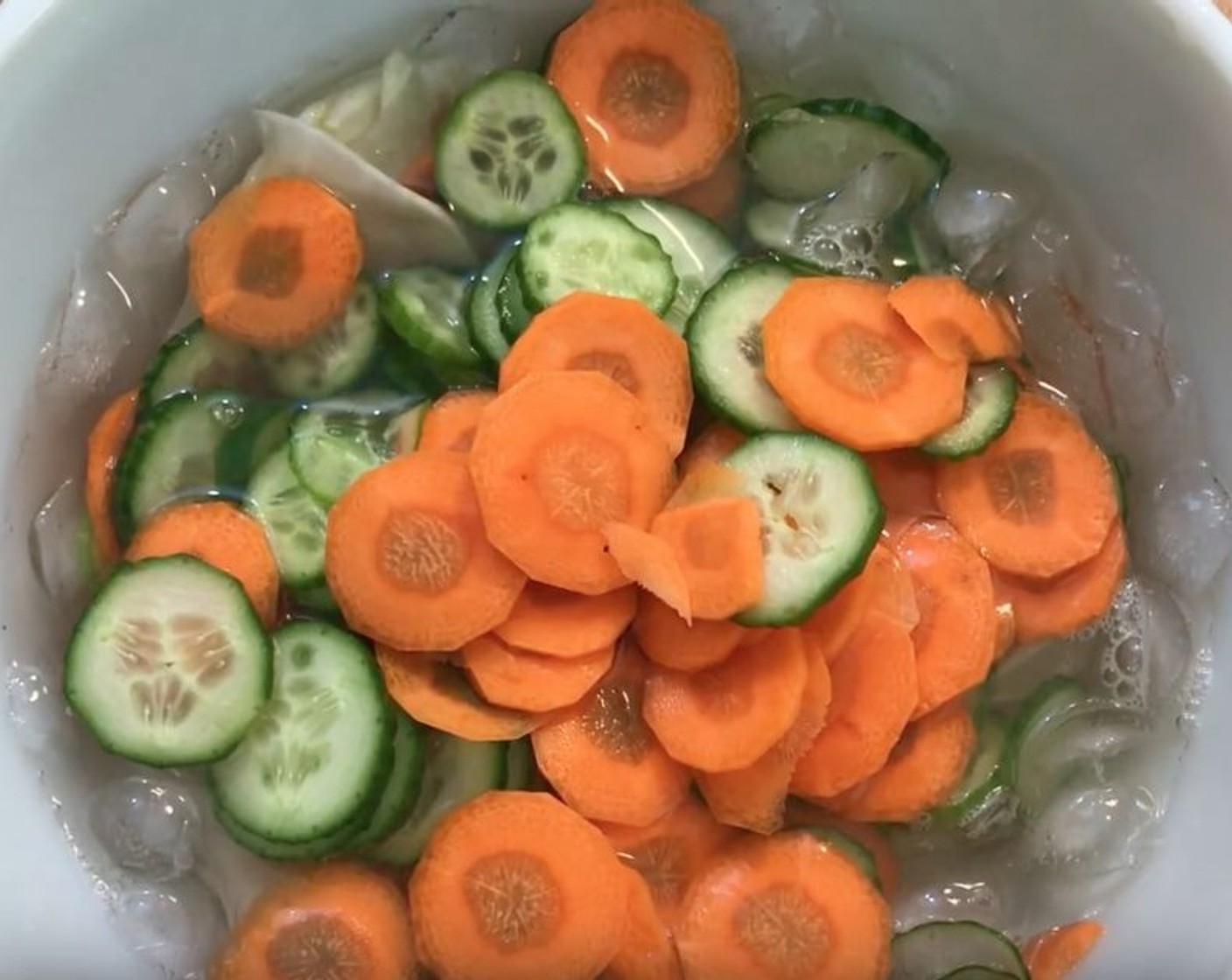 step 2 Submerge the Carrot (1), Armenian Cucumbers (2), and Kohlrabi (3) in ice water and let stand for about 15 minutes.