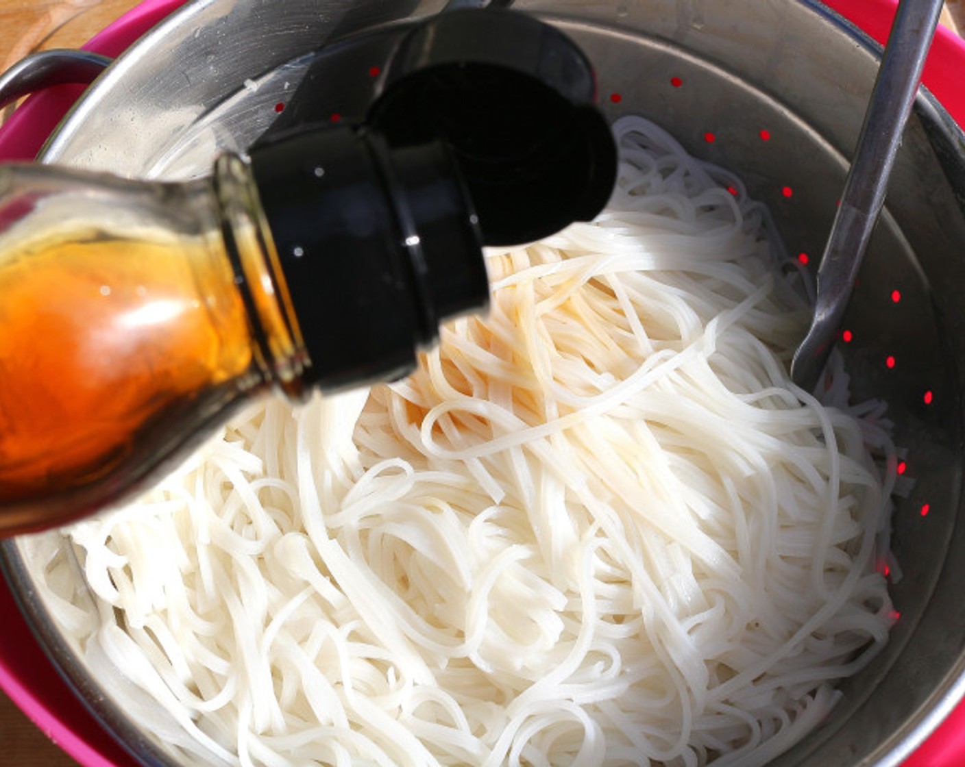 step 9 When the noodles are soft, drain and rinse, then stir with Toasted Sesame Oil (2 Tbsp).